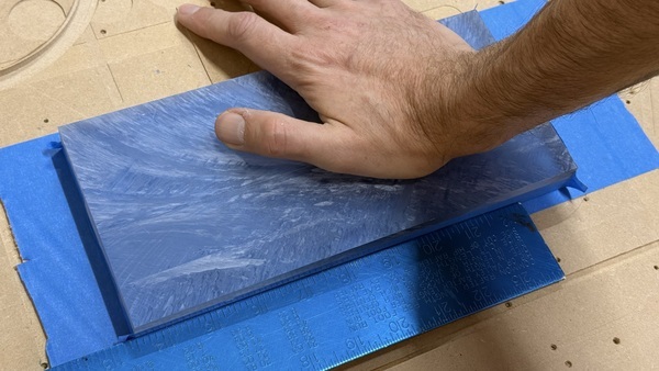 Hold the taped surfaces together